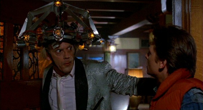 Doc Brown wearing his mind reading helmet looks shocked to see Marty